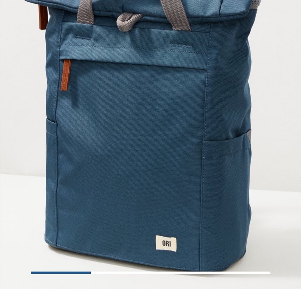 Modern Blue Backpack with Durable Fabric and Minimalist Design